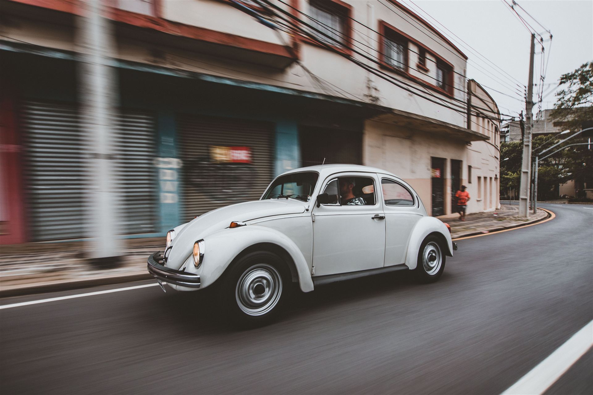 Classic car driving through the city