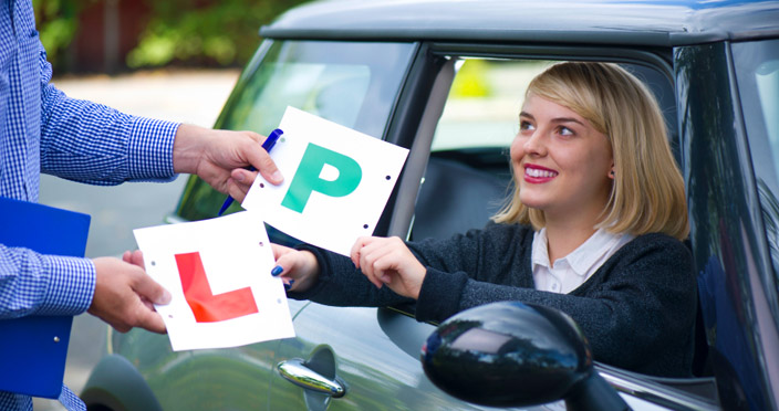 Learner receiving P plates after passing